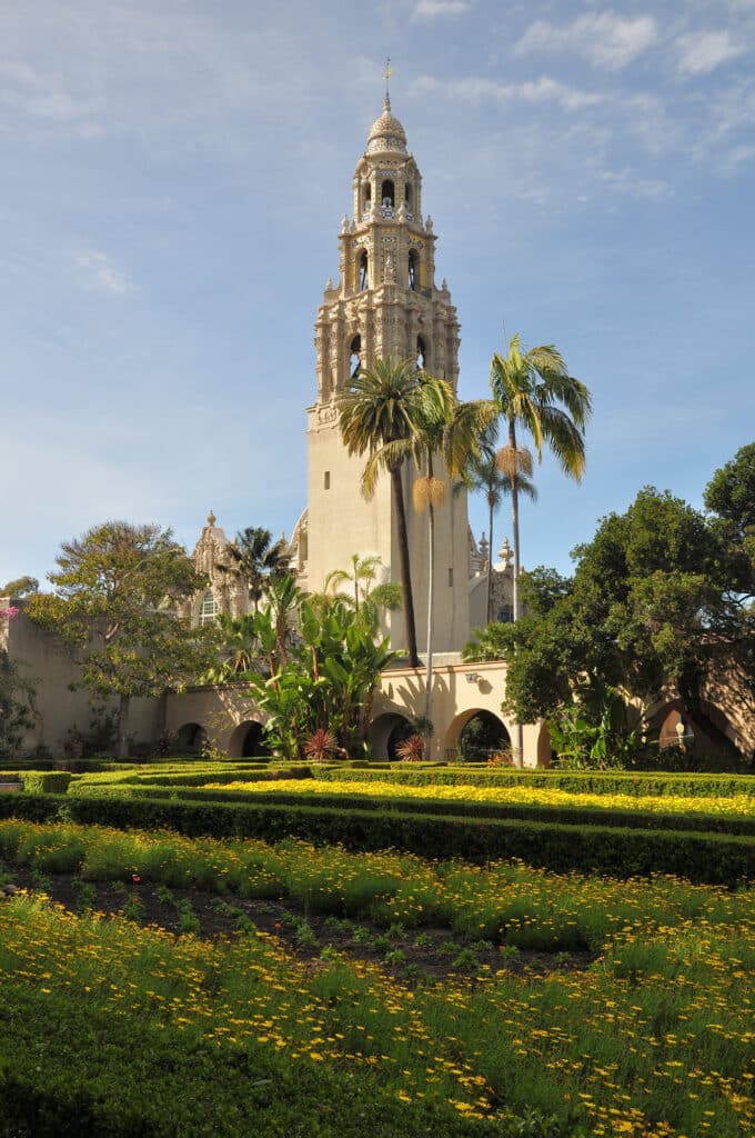 The California Tower rises above a peaceful garden in Balboa Park in the city of San Diego, California.